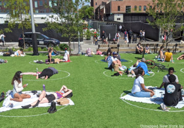 People on grass at Social distancing circles at Domino Park