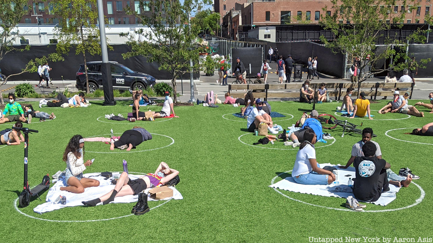 People on grass at Social distancing circles at Domino Park
