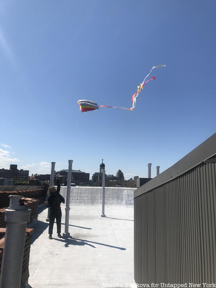 Flying kite on the roof
