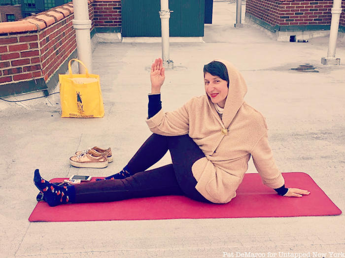 Woman doing yoga on rooftop