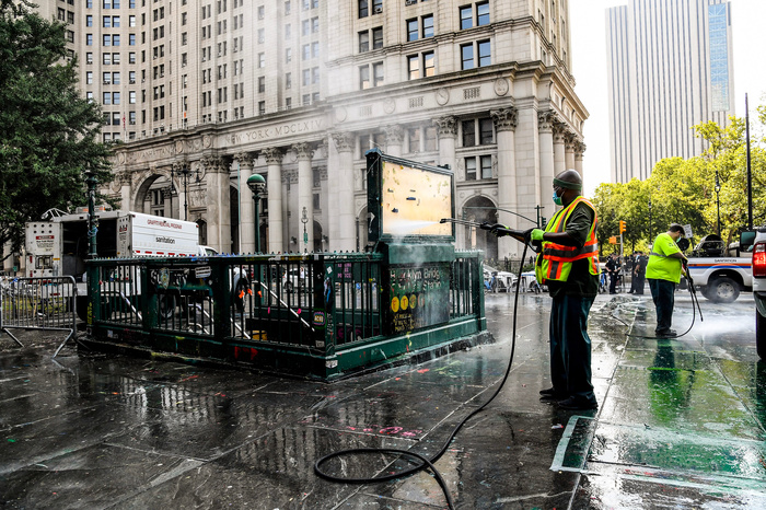 MTA workers cleanup the historic City Hall Subway Entrances