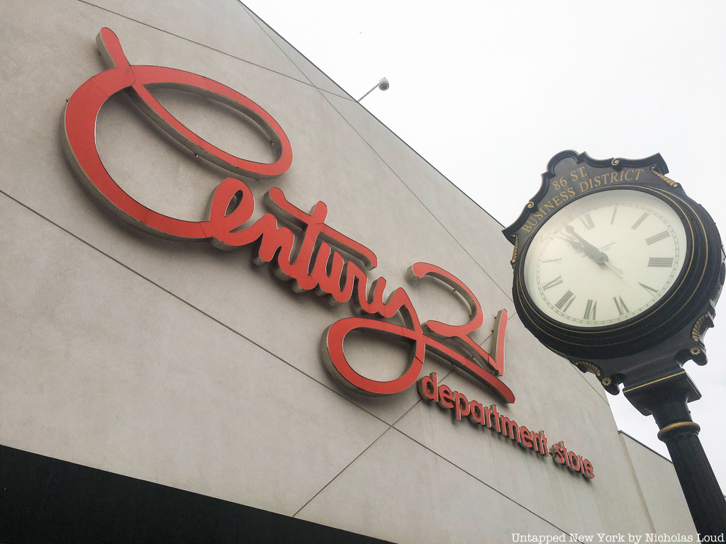 Detail of Century 21 Sign with vintage clock