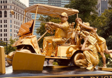 Donald Trump golf cart statue