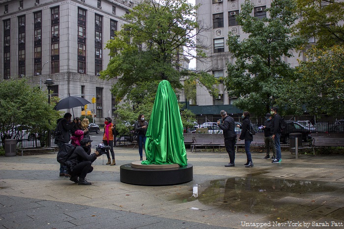 Photo of Medusa Sculpture covered by green cloth