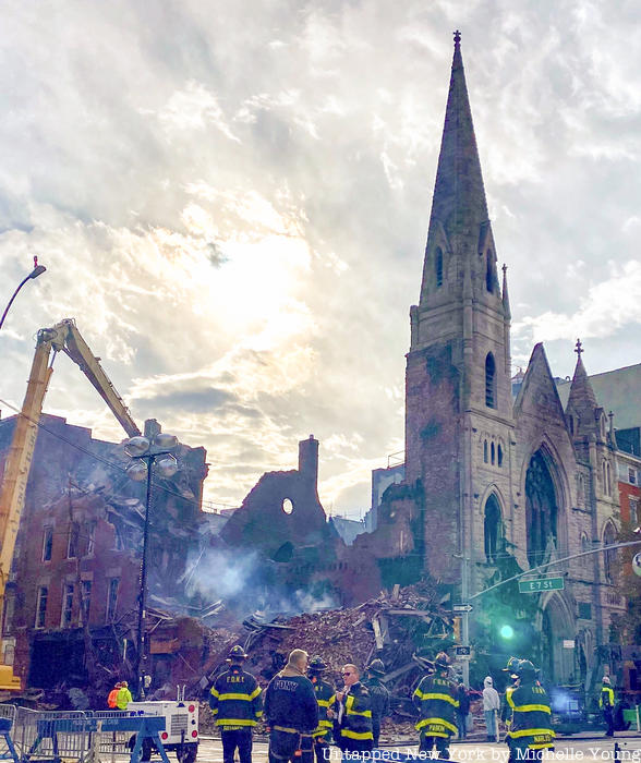 A wall from the church is destroyed by the fire