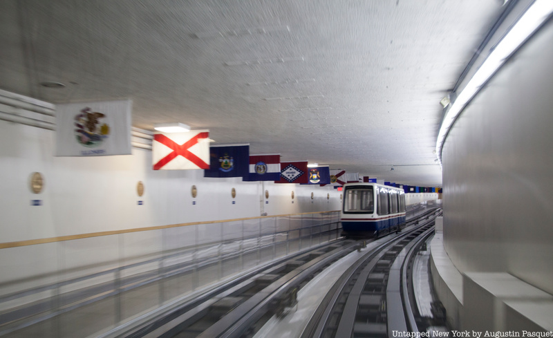 Tunnel with subway and walkway and flags under Capitol Hill