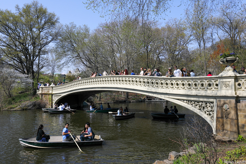 Bow Bridge with boaters in summer