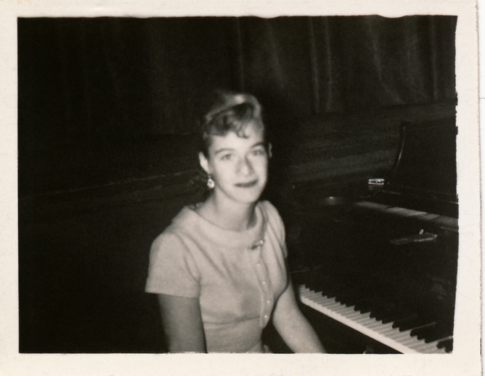 Carole King at a piano in James Madison High School