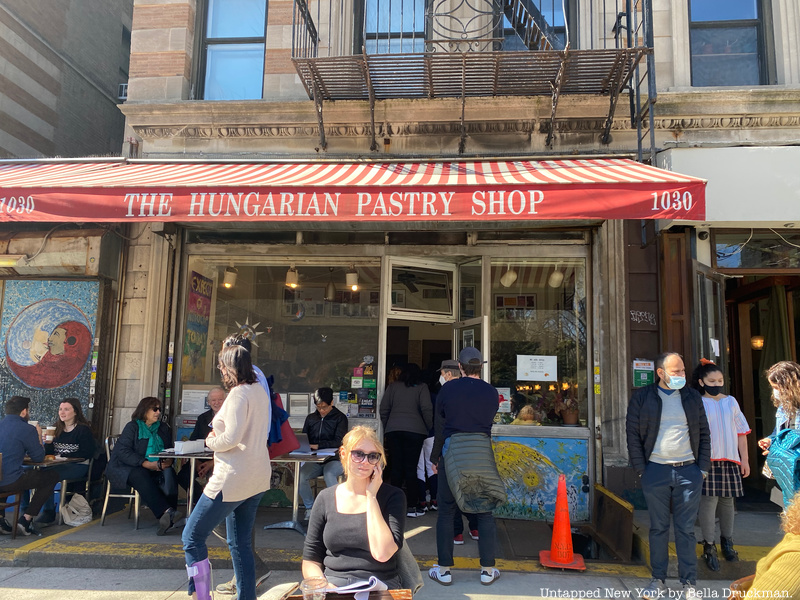 Influential authors and customers enjoy baked goods and coffee from Hungarian Pastry Shop.