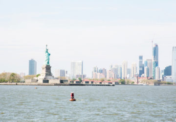 NYC skyline and the Statue of Liberty as seen from the water
