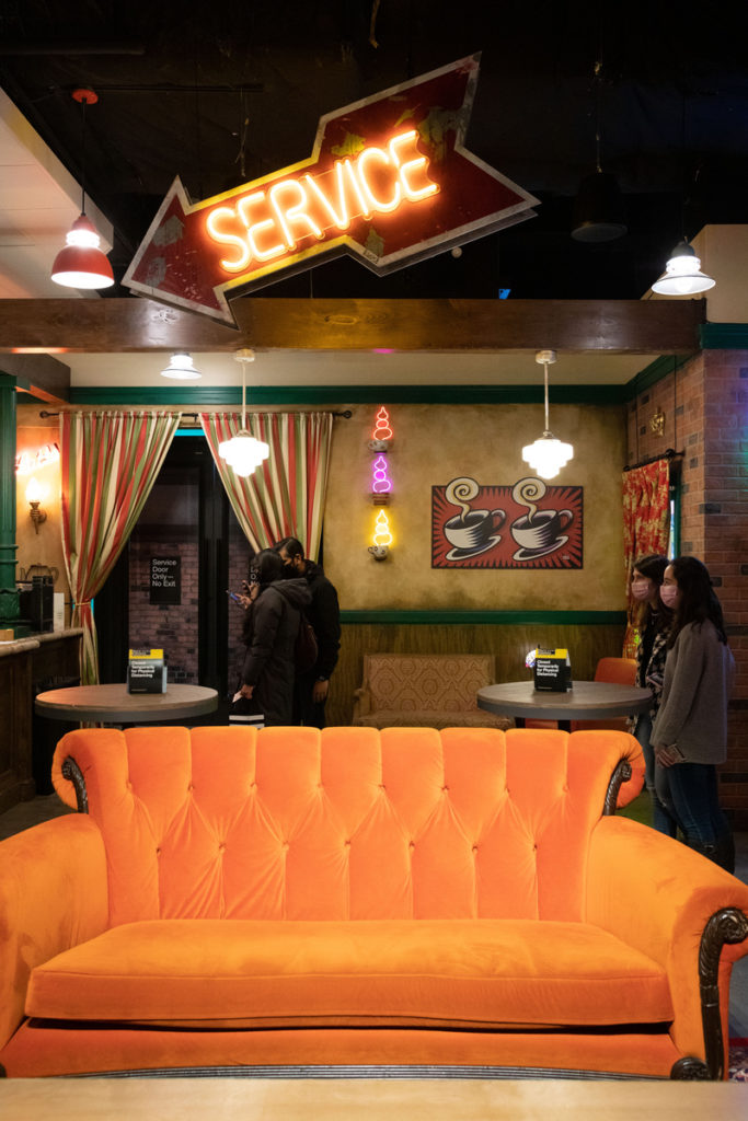 Orange couch in the FRIENDS EXPERIENCE located in New York City. Photo Courtesy of Booking.com.