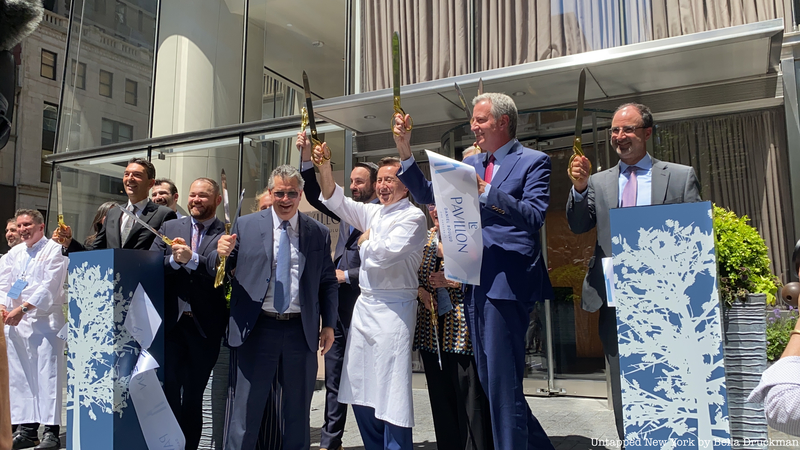 Boulud and company celebrate the cutting of the ribbon.