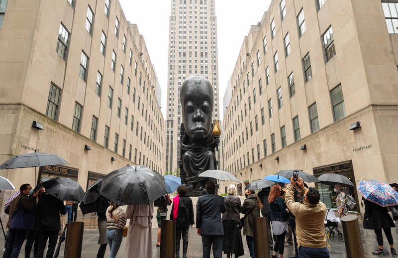 A 25-foot†bronze†sculpture,†titled†Oracle, by artist Sanford Biggers is unveiled at Rockefeller Centerís Channel Gardens,