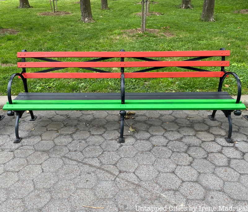 Bench in Juneteenth Grove painted in the colors of the Pan African Flag
