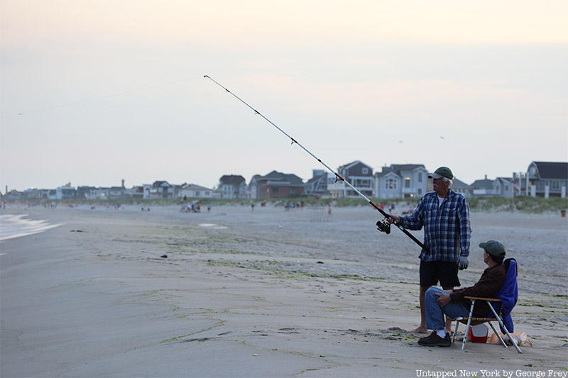 Two seniors fish on Rockaway Beach