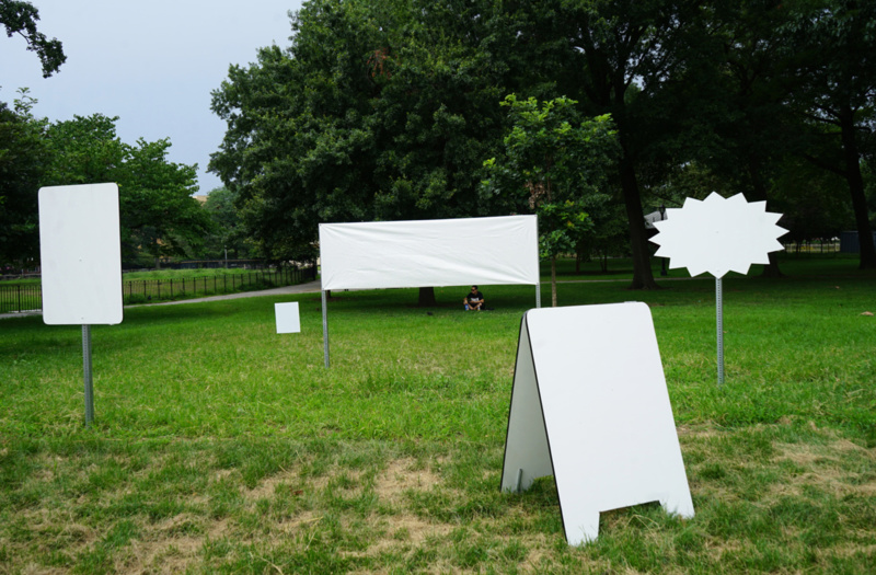 Image of outdoor sign installation at Rufus King Park. Photo by Karen Santiago.