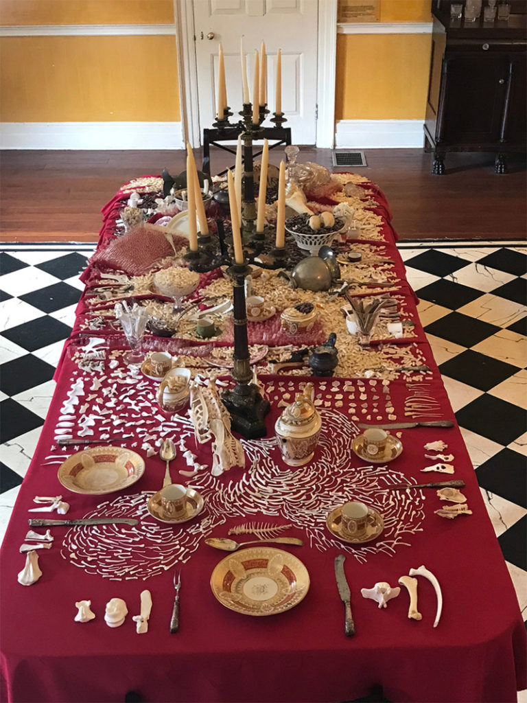 Image of dining room table from Beyond Life and Death exhibit. Courtesy of the Kelsey Brow (King Manor Museum). 