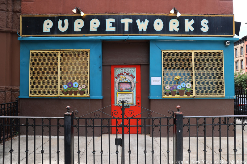 Puppetworks's vibrant red, yellow, and blue design beckons passersby in Park Slope inside