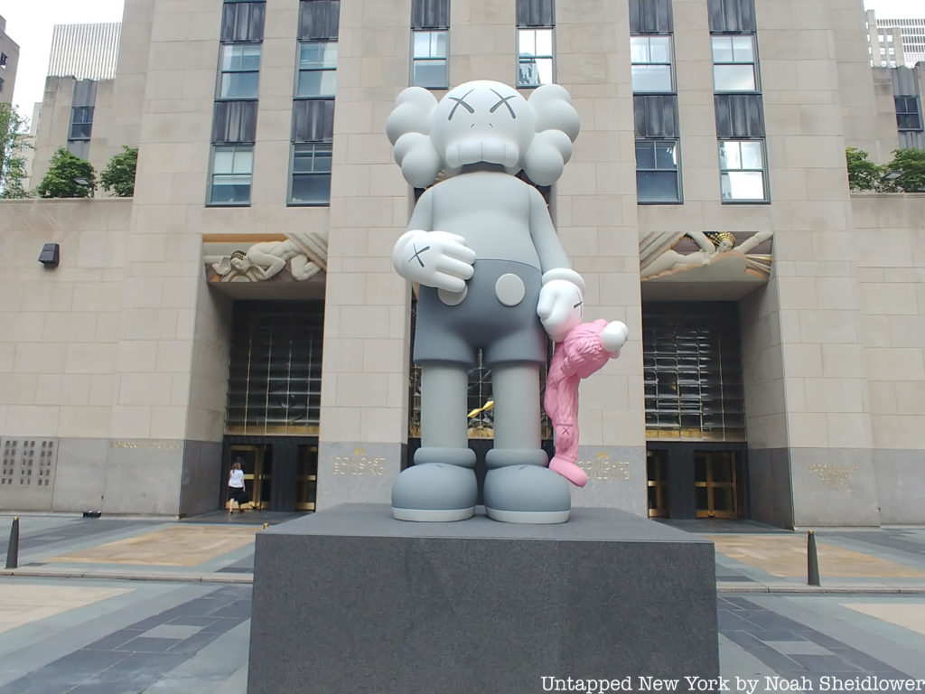 SHARE, KAWS' new 18 foot tall bronze sculpture at Rockefeller Center.
