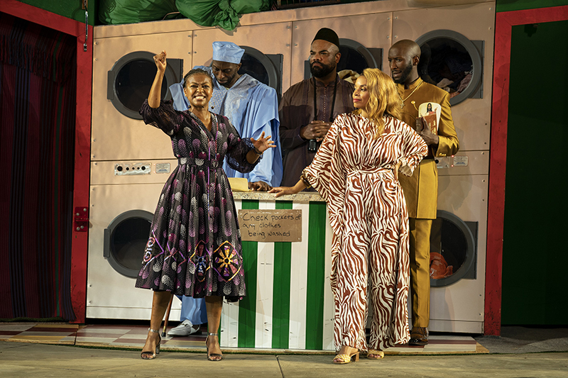 Merry Wives production in Central Park inside laundromat
