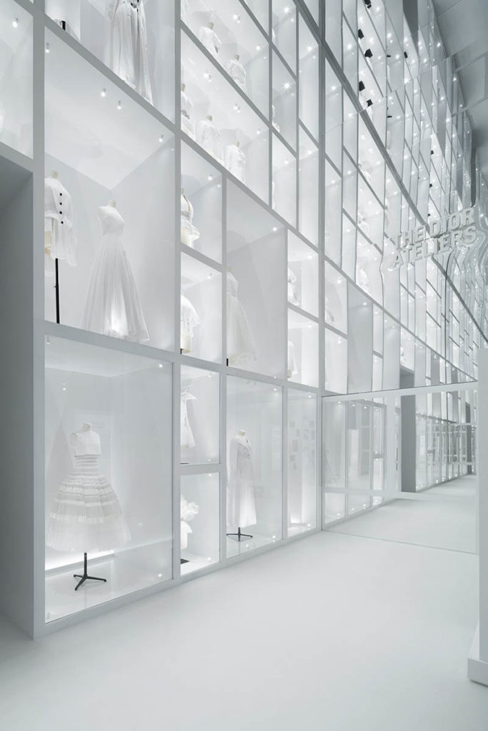 Christian Dior Designer of Dreams exhibition wall of dresses