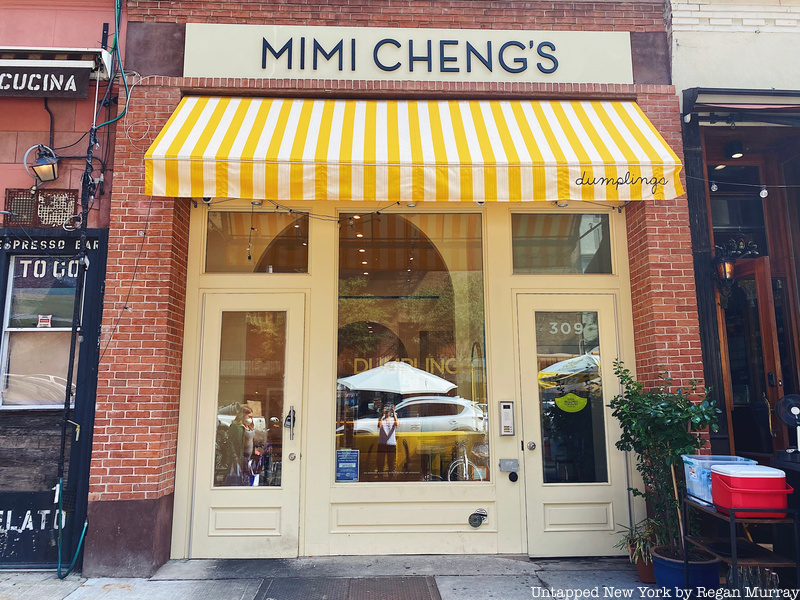 The outside of Mimi Cheng's, featuring creme trim and a yellow-and-white awning