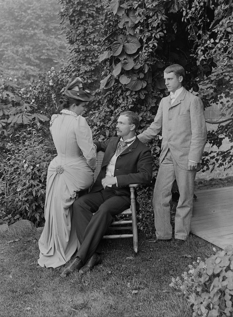 two men and a woman in Victorian garb