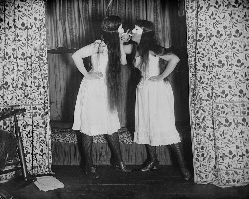two women in bloomers and masks
