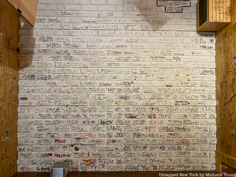 brick wall at Burger Joint NYC