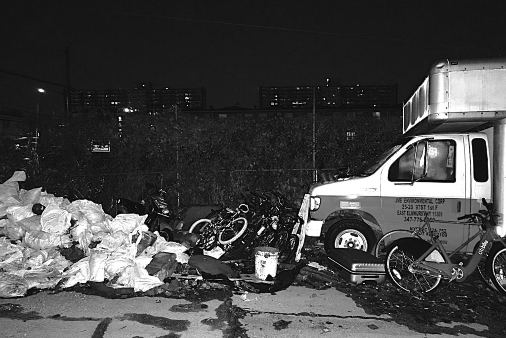  a truck and piles of garbage