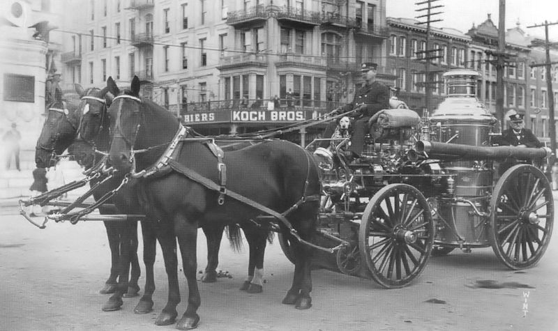 a horse drawn fire engine during the horse era