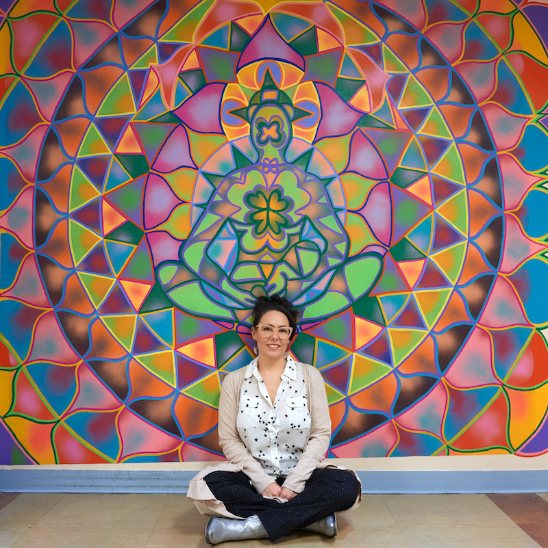Arantxa Rodriguez in front of her mural