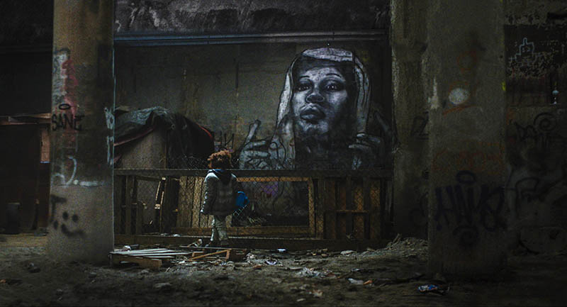 Zhalia Farmer with Chris Pape mural inside Topside movie