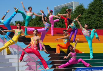 dancers on progress pride flag stairs