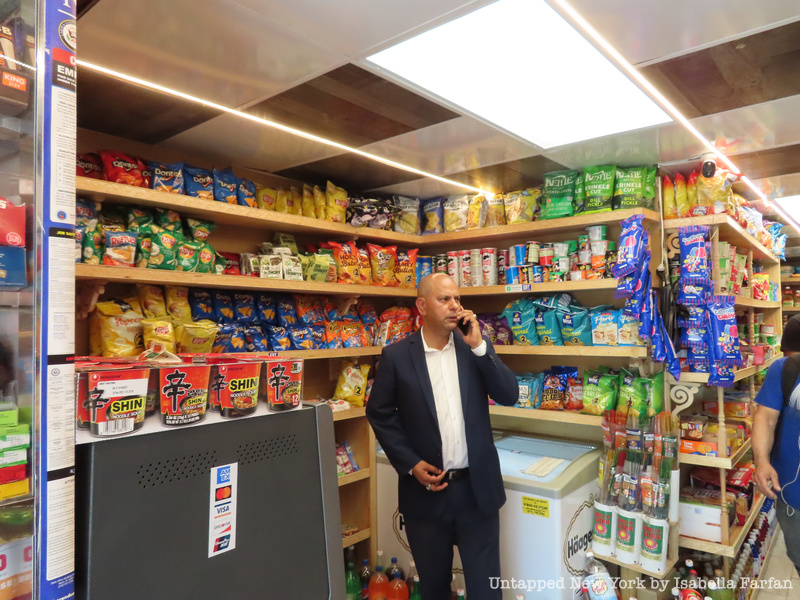 Marte takes a call in a bodega where he met Untapped New York.