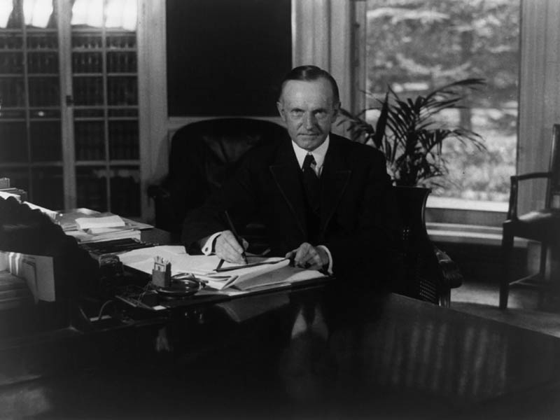 Calvin Coolidge at Oval Office desk