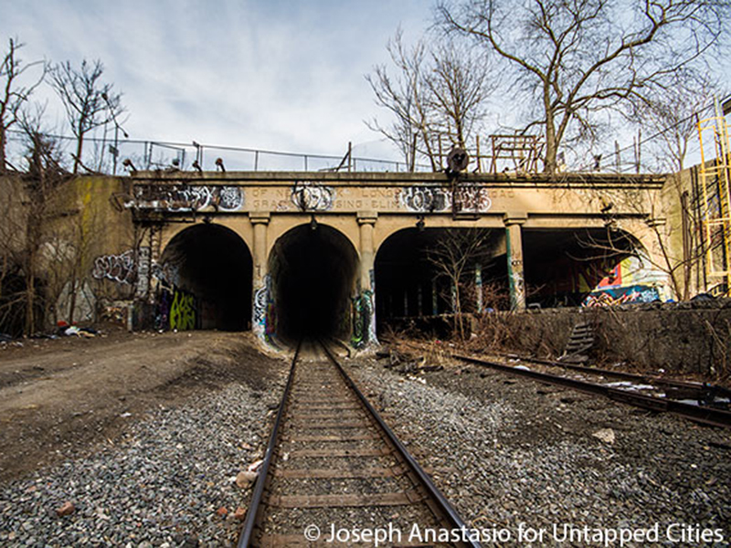 The south end of East New York freight tunnel, with the abandoned passenger platform on the right.
