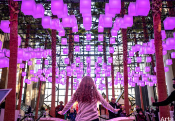 Purple glowing cubes float above the lobby of Brookfield Place in a winter public art installation.
