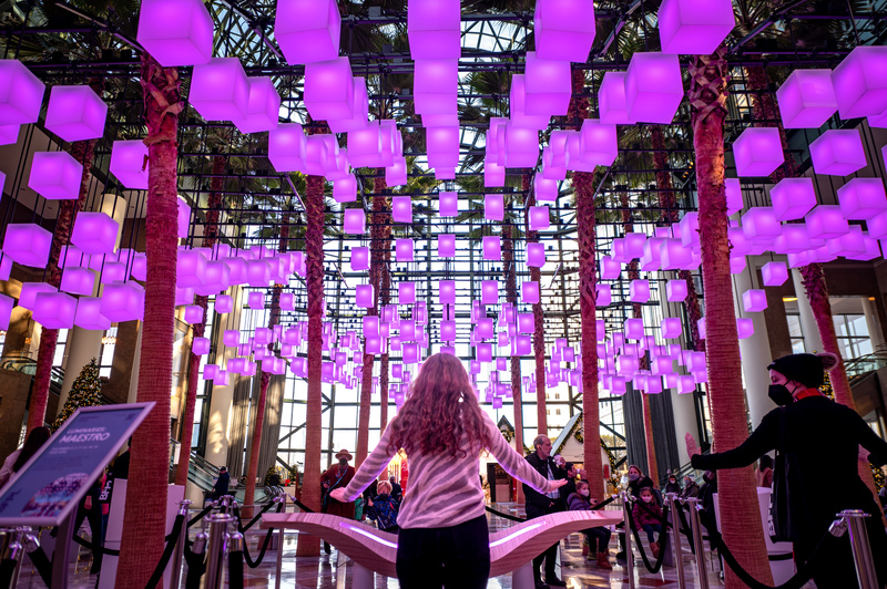 Purple glowing cubes float above the lobby of Brookfield Place, one of NYC's annual art installations in November.