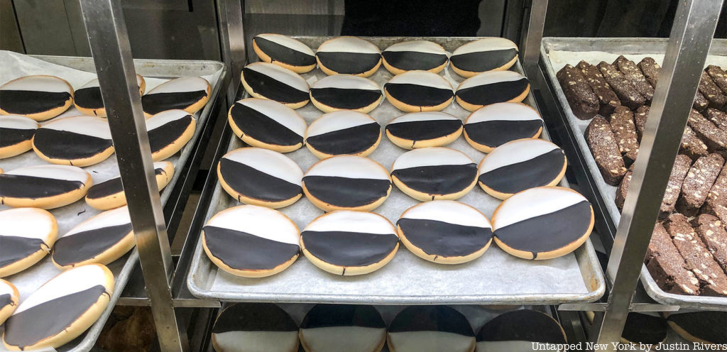 Black and white cookies on a bakery tray