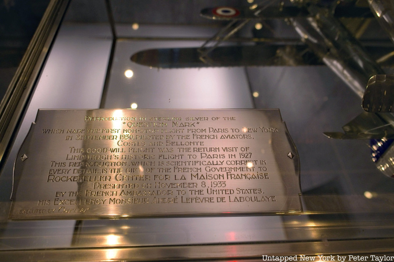 A plaque on the silver Cartier plane model