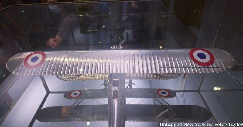 An overhead view at the wings of a silver Cartier plane in Rockefeller Center