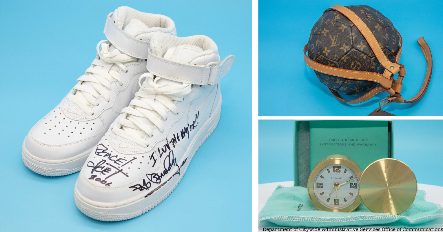 A pair of sneakers, a Louis Vuitton soccer ball and a gold desk clock