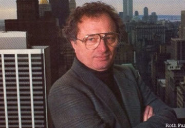 Richard Roth Jr. stands in front of a background of the NYC skyline