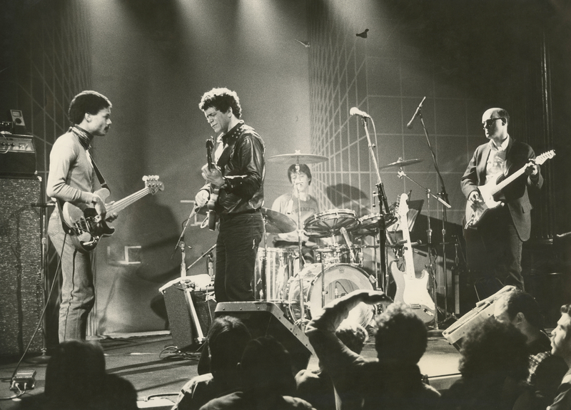 The Velvet Underground on stage in a black and white photo
