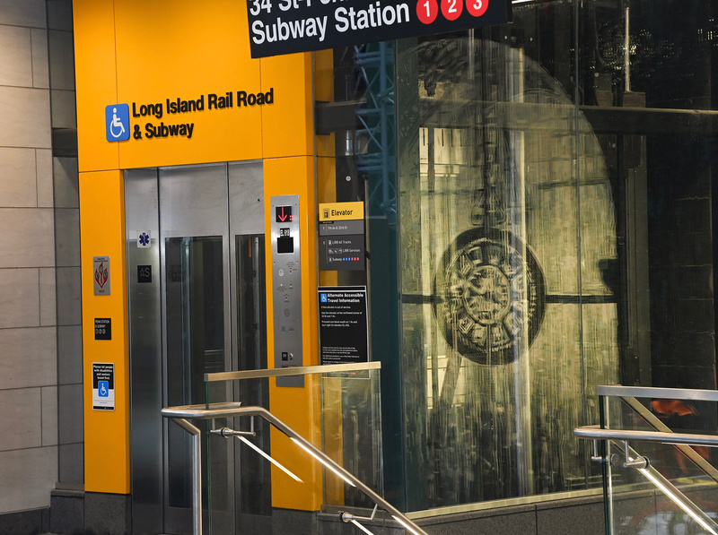 New elevator with yellow front at Penn Station