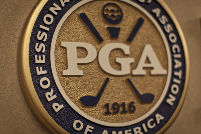 A round medallion that says "PGA Professional Golf Association of America"