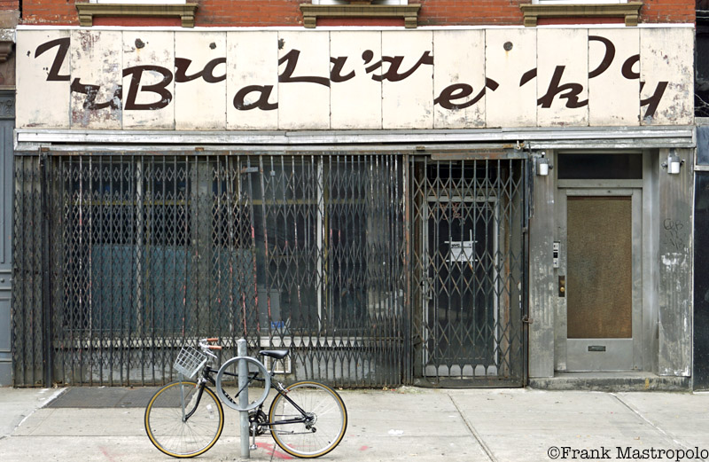 Dora's Bakery ghost sign in Williamsburg, Brooklyn is puzzling because its letters have been scrambled.