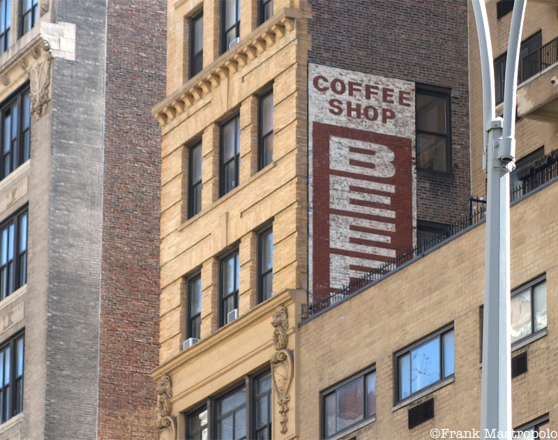 A ghost sign obscured by a newer building in the Flatiron District reads, "Coffee Shop Beef." It was the site of Beefburger Fair.