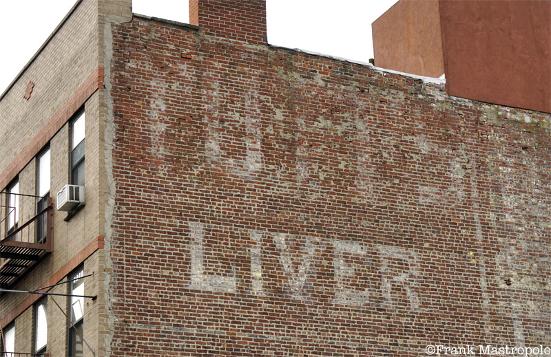 A faded ghost sign in East Harlem reads, "Liver." It once advertised Tutt's Liver Pills, a patent medicine.
